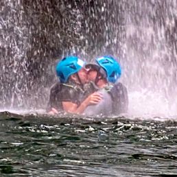 A little congratulations kiss under the falls.