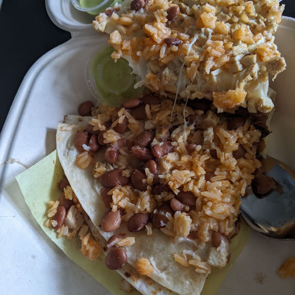Chicken quesadilla with beans served inside...