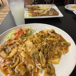 Latino's - Arroz con pollo and crema enchiladas!