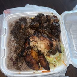 Oxtail, jerk chicken, rice and peas, plantains, and cabbage. Oxtail, jerk chicken, rice and peas, plantains, and cabbage.