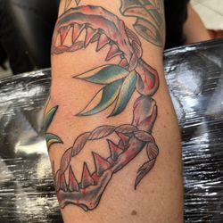 Sacred Art Tattoo Waikiki - Colorful detailed shark jaw tattoo design around the knee