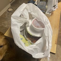 Two plates, one burrito one bean, you can see the damn cheese spilling out