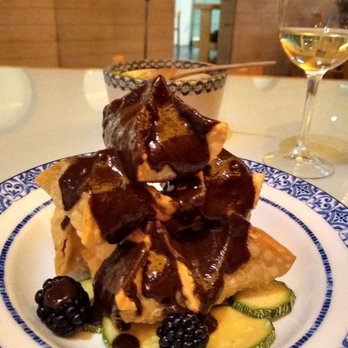 Azul - The house buñuelos, stuffed with duck, smothered in mole negro. It's even better than it looks. - Mexican Near Me - México, D.F., DIF