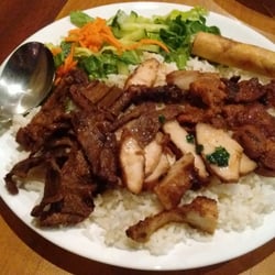 Grilled beef, chicken & pork with rice and spring roll $10.95.