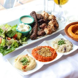 Old City Cafe & Grill - A Lebanese mixed grill served with fresh salads, dips, and traditional side dishes.