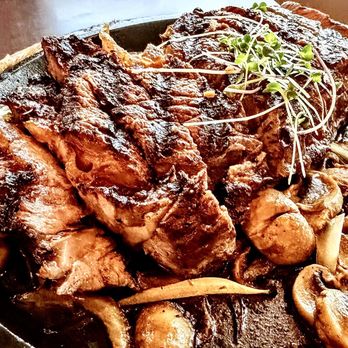 WSW Steakhouse - Sizzling 16oz Ribeye, dinner à la carte menu. Served with garlic mashed potatoes. - Steakhouses Near Me - Hilo, Hawaii
