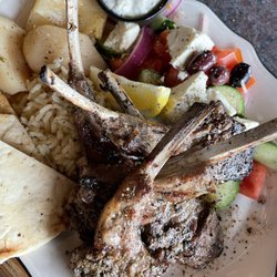 Karouzos Steakhouse - Tender, juicy rack of lamb and the best rice pilaf ever. Look at the chunks of feta with the Greek salad!