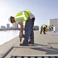 Empire Roof Coatings - Adding roof installation board for even greater energy efficiency.