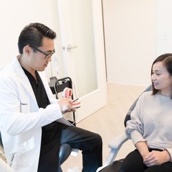 KYT Dental Services - Family Dentist Dr. Isaac Sun Assisting Dental Patient
