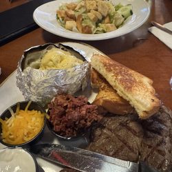 Ribeye steak with Baked Potato and salad