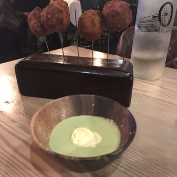 Lechon - White corn cheese fritters. Super delicious! (Aji verde sauce a little spicy) - Tapas Bars Near Me - Portland, Oregon Lechon - White corn cheese fritters. Super delicious! (Aji verde sauce a little spicy) - Tapas Bars Near Me - Portland, Oregon