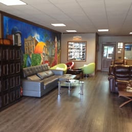 Customized cigar lockers , large humidor and modern smoking lounge @ Churchhill Fine Cigars