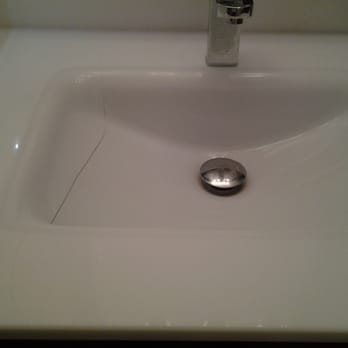 Home Ko - a bathroom sink with a faucet and soap dispenser - Flooring Near Me - Miami, Florida Home Ko - a bathroom sink with a faucet and soap dispenser - Flooring Near Me - Miami, Florida
