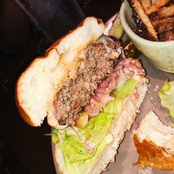 Boca - The burger cut in half.... so juicy and flavorful. - New American Near Me - Sarasota, Florida