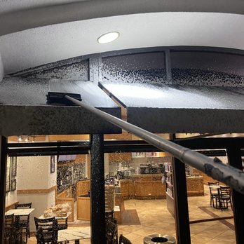 Formula Window Cleaning - Process awning sprayed with eco-friendly chemicals to remove any dirt and grind buildup - Window Washing Near Me - Los Angeles, California Formula Window Cleaning - Process awning sprayed with eco-friendly chemicals to remove any dirt and grind buildup - Window Washing Near Me - Los Angeles, California
