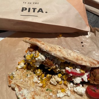 CAVA - Pita bread with falafel. Red pepper hummus, black lentils and feta cheese - Mediterranean Near Me - Atlanta, Georgia CAVA - Pita bread with falafel. Red pepper hummus, black lentils and feta cheese - Mediterranean Near Me - Atlanta, Georgia