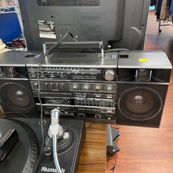 Goodwill - A vintage boombox-style radio and cassette player.