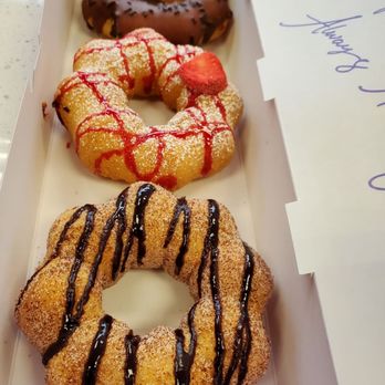 Mochinut - Chocolate Iced (back), Strawberry Funnel Cake (center), and Cinnamon Churro (front) - Donuts Near Me - South Jordan, Utah Mochinut - Chocolate Iced (back), Strawberry Funnel Cake (center), and Cinnamon Churro (front) - Donuts Near Me - South Jordan, Utah