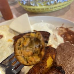 Chorizo, delicious. Crema w/a bean sauce and a wedge of El Salvadorian cheese. Dos Huevos sunny side up. Perfection!!! Chorizo, delicious. Crema w/a bean sauce and a wedge of El Salvadorian cheese. Dos Huevos sunny side up. Perfection!!!