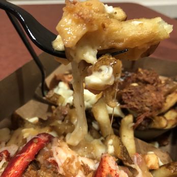 Golden Fries Chip Wagon - a fork picking up a piece of fries - Fast Food Near Me - Orleans, Ontario Golden Fries Chip Wagon - a fork picking up a piece of fries - Fast Food Near Me - Orleans, Ontario