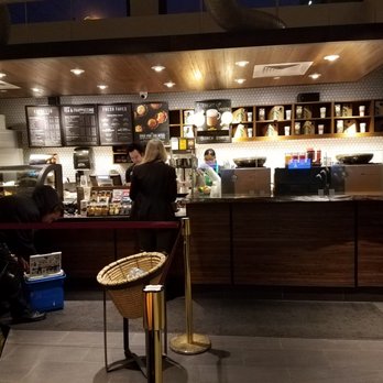 Starbucks - a coffee shop with people working at the counter - Coffee & Tea Near Me - Toronto, Ontario
