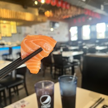 Yippon Ramen - Salmon Sashimi and Restaurant in background. - Sushi Bars Near Me - San Antonio, Texas Yippon Ramen - Salmon Sashimi and Restaurant in background. - Sushi Bars Near Me - San Antonio, Texas