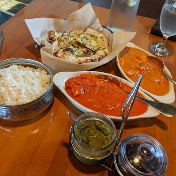 Indian Twist - Garlic naan, butter chicken, chicken Tikka masala with a side of rice - Indian Near Me - Tucson, Arizona