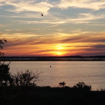 Waterside Motor Inn - View of bay at sunset from our balcony. - Hotels Near Me - Chincoteague Island, Virginia Waterside Motor Inn - View of bay at sunset from our balcony. - Hotels Near Me - Chincoteague Island, Virginia