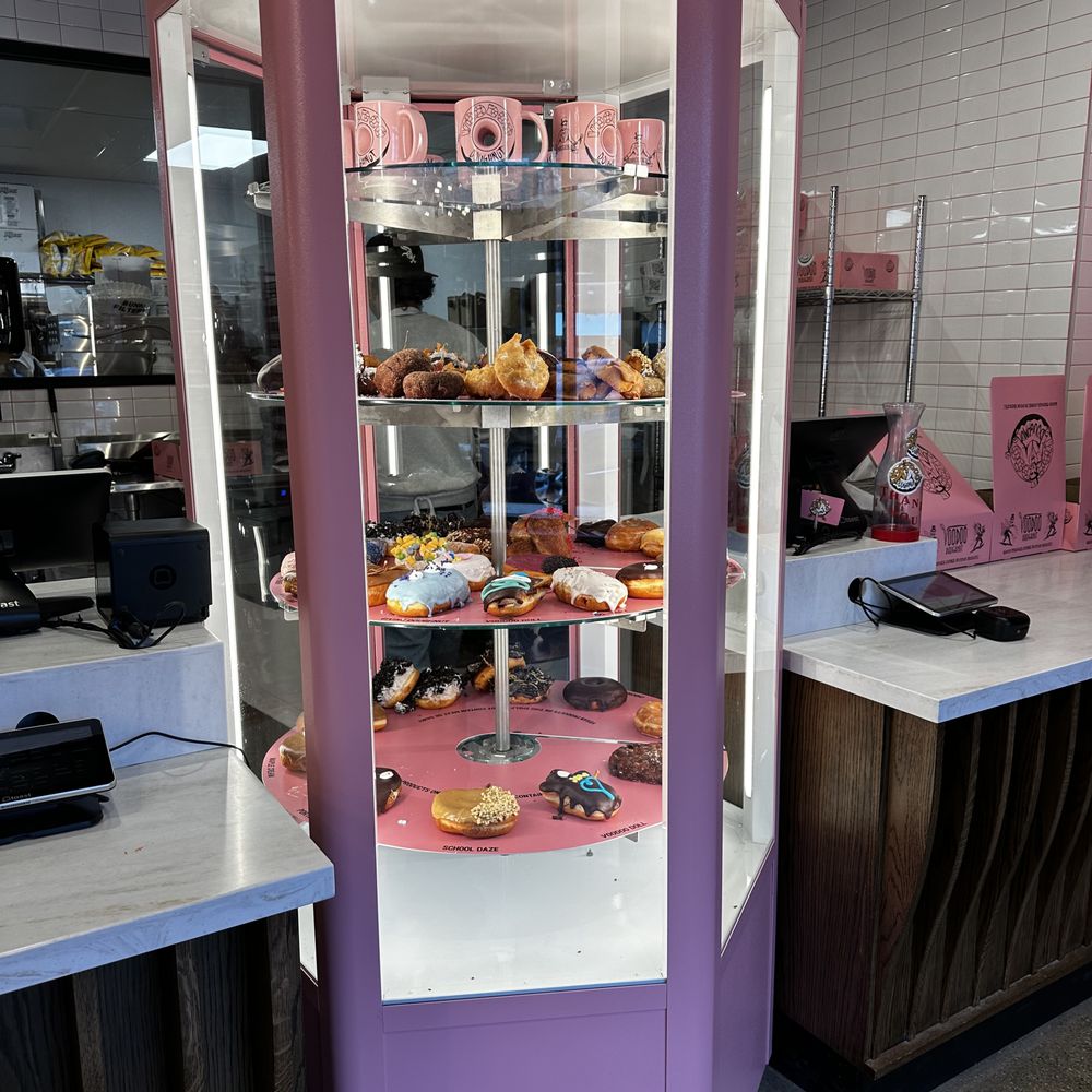 Voodoo Doughnut - The revolving display cases highlight the numerous variety of donuts. - Donuts Near Me - Chicago, Illinois Voodoo Doughnut - The revolving display cases highlight the numerous variety of donuts. - Donuts Near Me - Chicago, Illinois