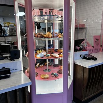 Voodoo Doughnut - The revolving display cases highlight the numerous variety of donuts. - Donuts Near Me - Chicago, Illinois Voodoo Doughnut - The revolving display cases highlight the numerous variety of donuts. - Donuts Near Me - Chicago, Illinois