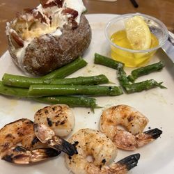 George's Fine Steaks & Spirits - Shrimp dinner..!! The baked potato was filled with good stuff!!  5-6 shrimp on the plate!!