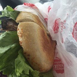 a sandwich wrapped in plastic