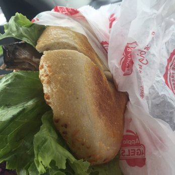 Big Apple Bagels - a sandwich wrapped in plastic - Breakfast & Brunch Near Me - Holland, Michigan
