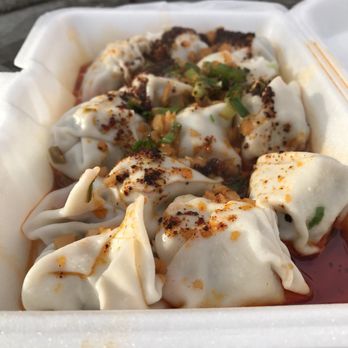 White Bear - Wontons doused with chili oil and a sprinkle of scallions and sunkissed by the December daylight - Chinese Near Me - Flushing, New York White Bear - Wontons doused with chili oil and a sprinkle of scallions and sunkissed by the December daylight - Chinese Near Me - Flushing, New York