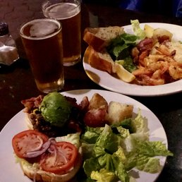 LA Burger with Avocado and garlic prawns in the back serve with garlic bread