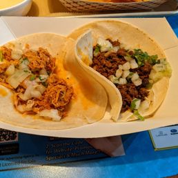 A Chorizo Taco and a Spicy Tinga Chicken Taco A Chorizo Taco and a Spicy Tinga Chicken Taco