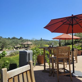 Tablas Creek Vineyard - Outdoor seating area overlooking vineyard - Wineries Near Me - Paso Robles, California