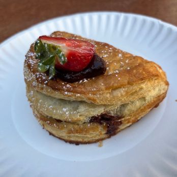 Gran Milan - a stack of pancakes on a paper plate - Pizza Near Me - Richmond, California Gran Milan - a stack of pancakes on a paper plate - Pizza Near Me - Richmond, California