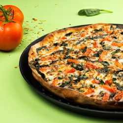 Spinato's Pizzeria and Family Kitchen - Mamma's Signature Pizza: Fresh Garlic, Secret Spice Blend, Spinach, Roma Tomato