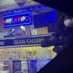Cloud 9 Smoke Shop, Vape, & Hookah Co. - Virginia Highlands - Outside smoking besides helping me