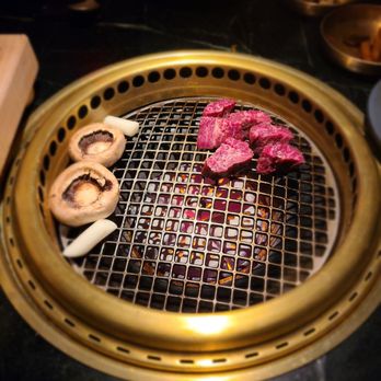 COTE Miami - Beef and mushrooms being cooked - Korean Near Me - Miami, Florida COTE Miami - Beef and mushrooms being cooked - Korean Near Me - Miami, Florida