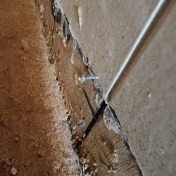 ADVANCED CONCRETE DESIGNS - Nails left sticking out of wall
