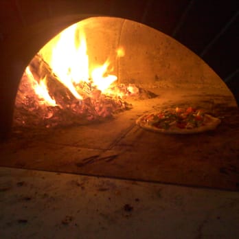 Red Oven - Wood Fired Pizza in a hand crafted Mugnaini pizza oven - Pizza Near Me Red Oven - Wood Fired Pizza in a hand crafted Mugnaini pizza oven - Pizza Near Me