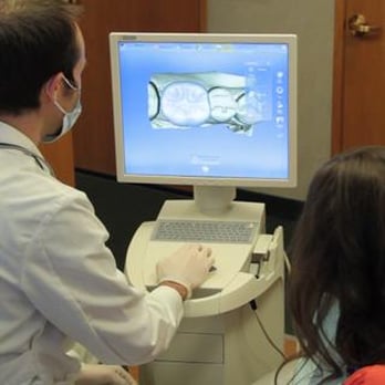 Nathan E Vick - utilizing CEREC technology to fabricate a crown in a single appointment - Cosmetic Dentists Near Me - Fresno, California