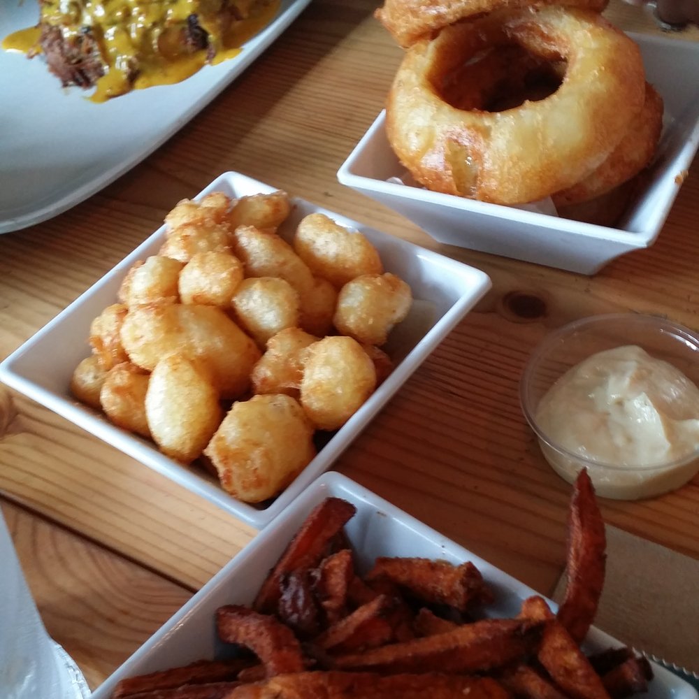 Uneeda Burger - Top: yummy onion rings Middle: DELICIOUS cheese curds Bottom: average sweet potato fries - Burgers Near Me - Seattle, Washington Uneeda Burger - Top: yummy onion rings Middle: DELICIOUS cheese curds Bottom: average sweet potato fries - Burgers Near Me - Seattle, Washington