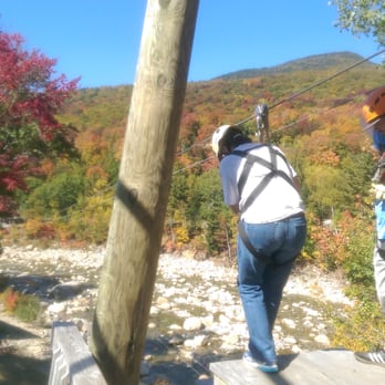 Loon Mountain Summer Adventures - steppin' off the platform to zipline over the river - Hotels Near Me - Lincoln, New Hampshire Loon Mountain Summer Adventures - steppin' off the platform to zipline over the river - Hotels Near Me - Lincoln, New Hampshire
