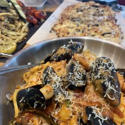 a bowl of pasta and mussels a bowl of pasta and mussels