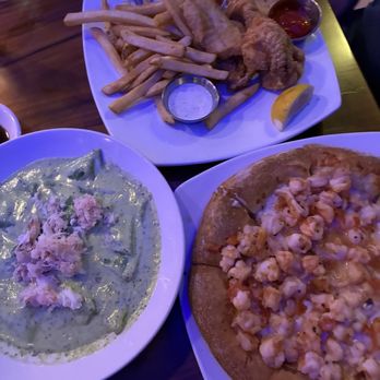 Catch - Roasted Garlic Shrimp Pizza Shrimp And Crab Ravioli and Home Made Beer Battered Fish And Chips - Seafood Near Me - Carmel, California