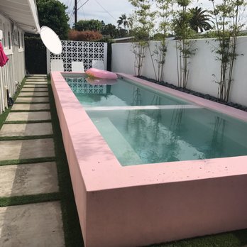 Calimingo Pools - Pool, concrete/grass hardscape/white smooth finish wall/decorative wall - all by Jesse and Proscapes - Landscape Architects or Designers Near Me - Newport Beach, California Calimingo Pools - Pool, concrete/grass hardscape/white smooth finish wall/decorative wall - all by Jesse and Proscapes - Landscape Architects or Designers Near Me - Newport Beach, California