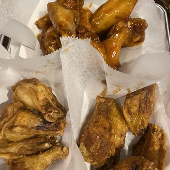 Fire Wings - Left (plain for my infant son) mango habanero (center back) and right Malaysian curry flavor (yum!) - Chicken Wings Near Me - Midtown, California